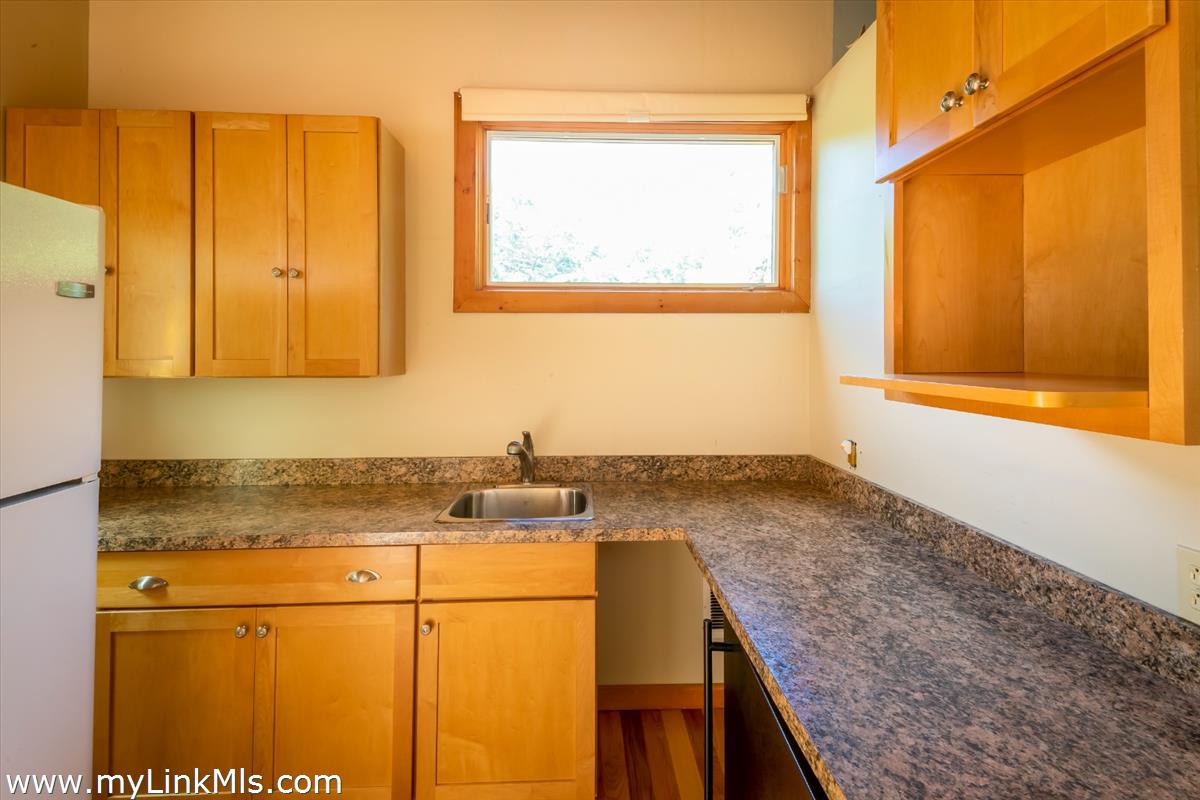 56 North Neck Road Edgartown, MA 02539 - Photo 34 of 63 a bathroom with a granite countertop sink and a mirror