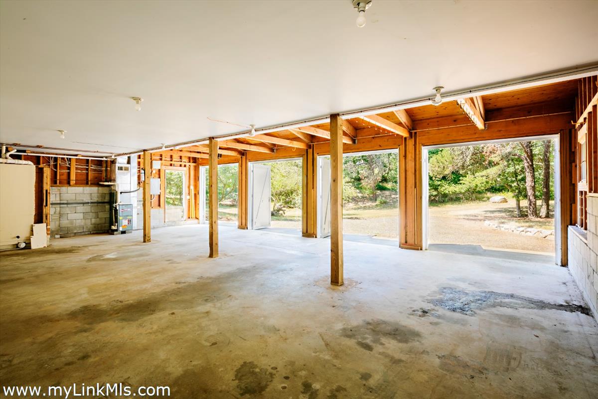 56 North Neck Road Edgartown, MA 02539 - Photo 40 of 63 a view of an empty room with a sliding door and wooden floor