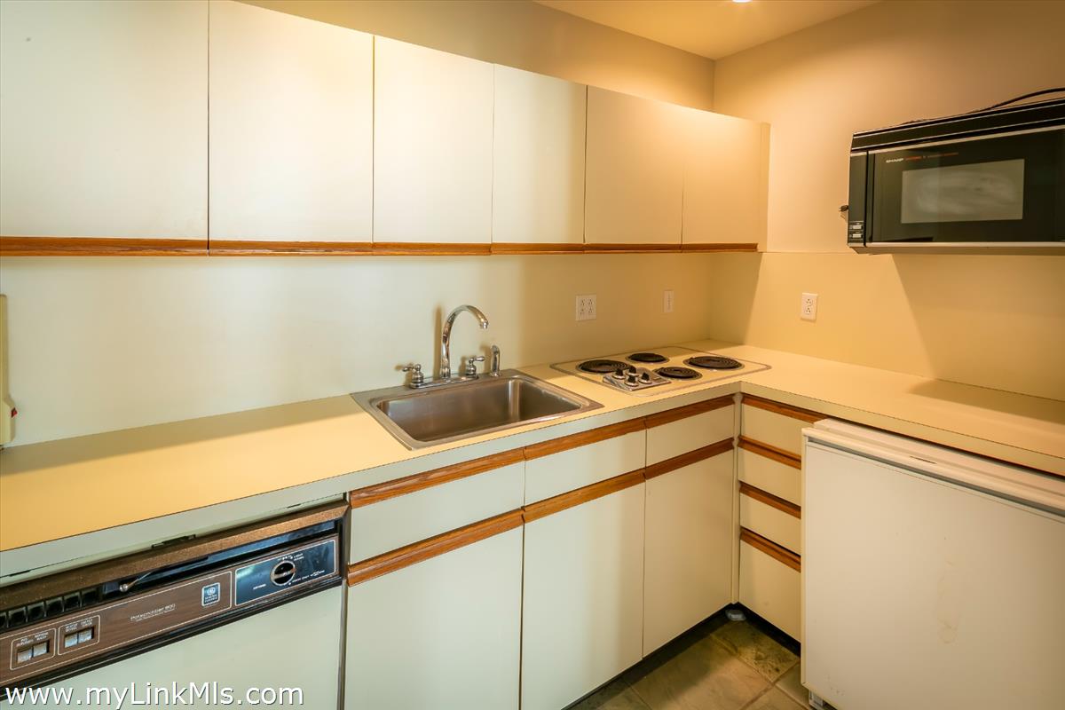 56 North Neck Road Edgartown, MA 02539 - Photo 48 of 63 a kitchen with a sink and cabinets