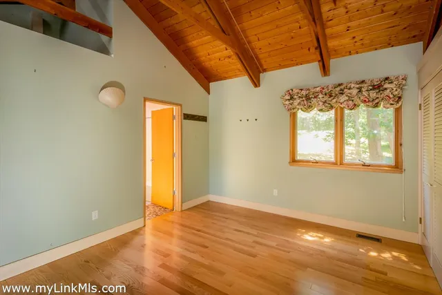 an aerial view of a house with a yard and garden
