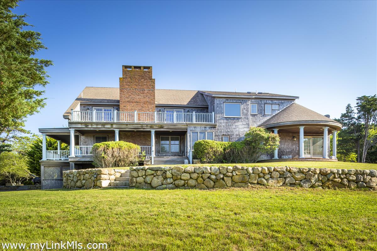 56 North Neck Road Edgartown, MA 02539 - Photo 5 of 63 a front view of a house with a yard