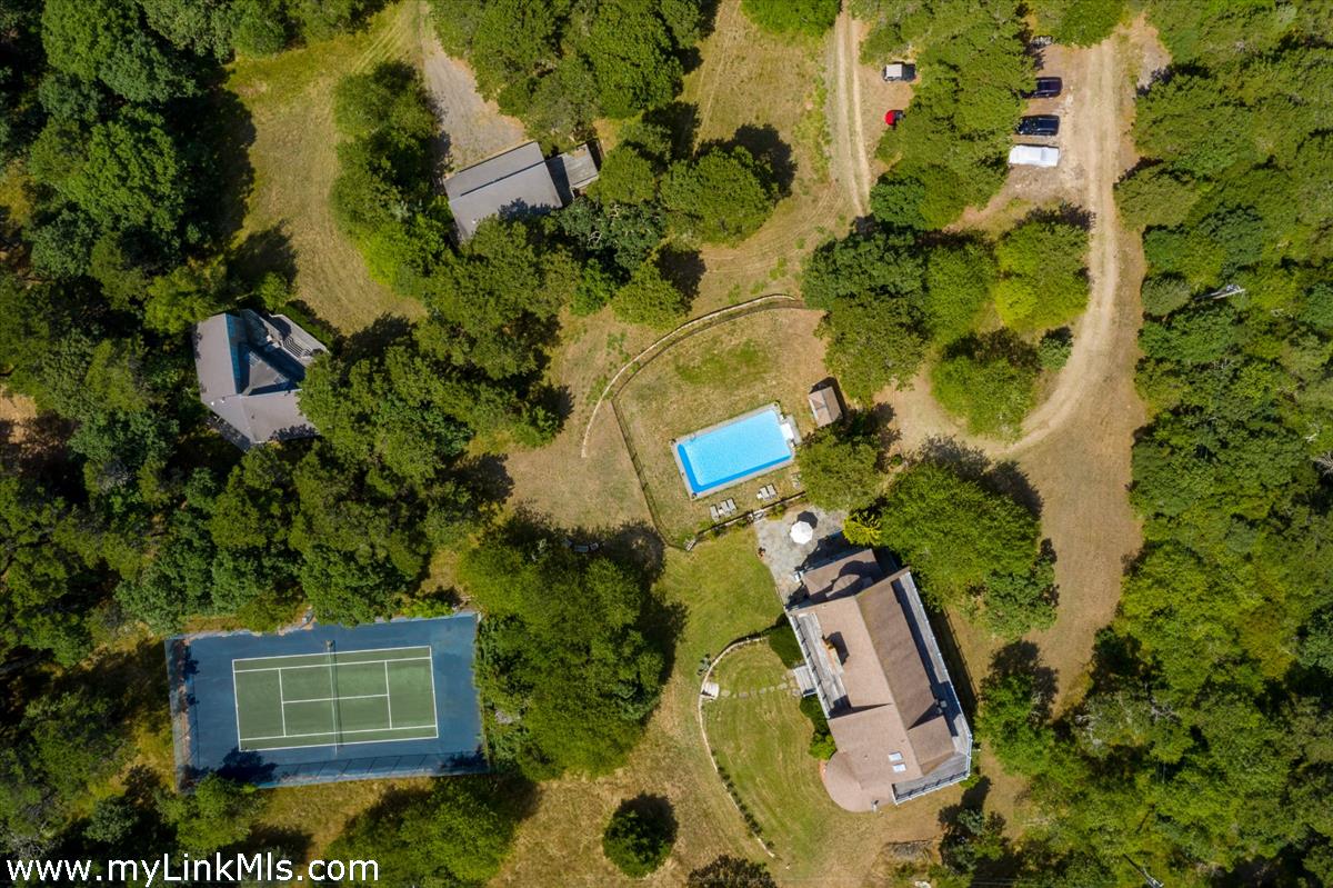 56 North Neck Road Edgartown, MA 02539 - Photo 62 of 63 an aerial view of a house with a yard and garden