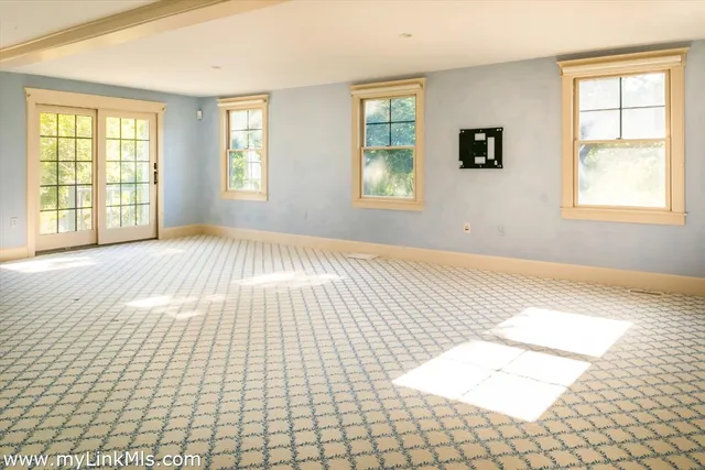 a view of an empty room and window