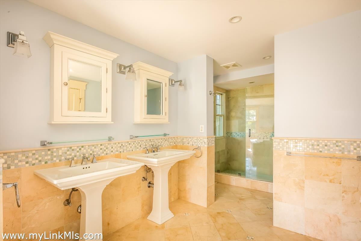 56 North Neck Road Edgartown, MA 02539 - Photo 10 of 63 a bathroom with a sink and a mirror