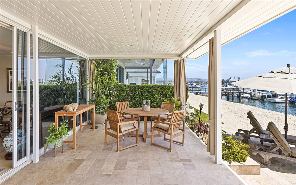 7 Beacon Bay Newport Beach, CA 92660 - Photo 15 of 59 a balcony with furniture and outdoor view