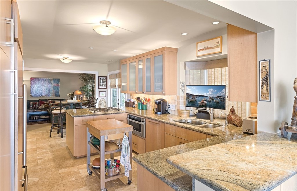 7 Beacon Bay Newport Beach, CA 92660 - Photo 24 of 59 a kitchen with stainless steel appliances granite countertop sink stove and refrigerator