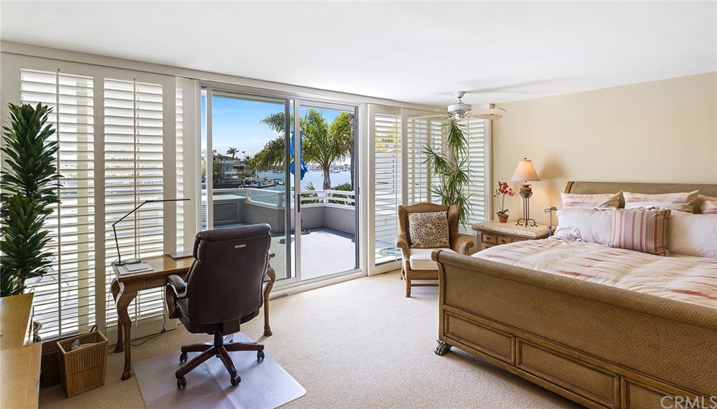 7 Beacon Bay Newport Beach, CA 92660 - Photo 28 of 59 a bedroom with a bed and a large window