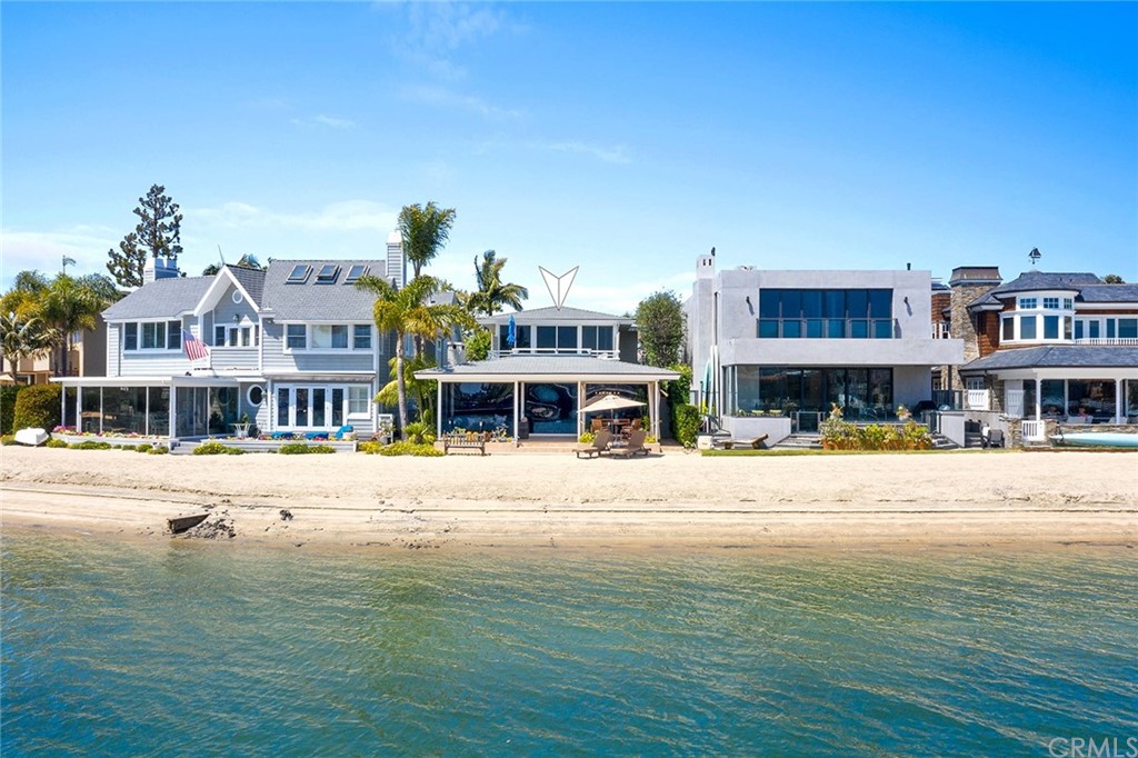 7 Beacon Bay Newport Beach, CA 92660 - Photo 3 of 59 a view of an ocean with a building in the background