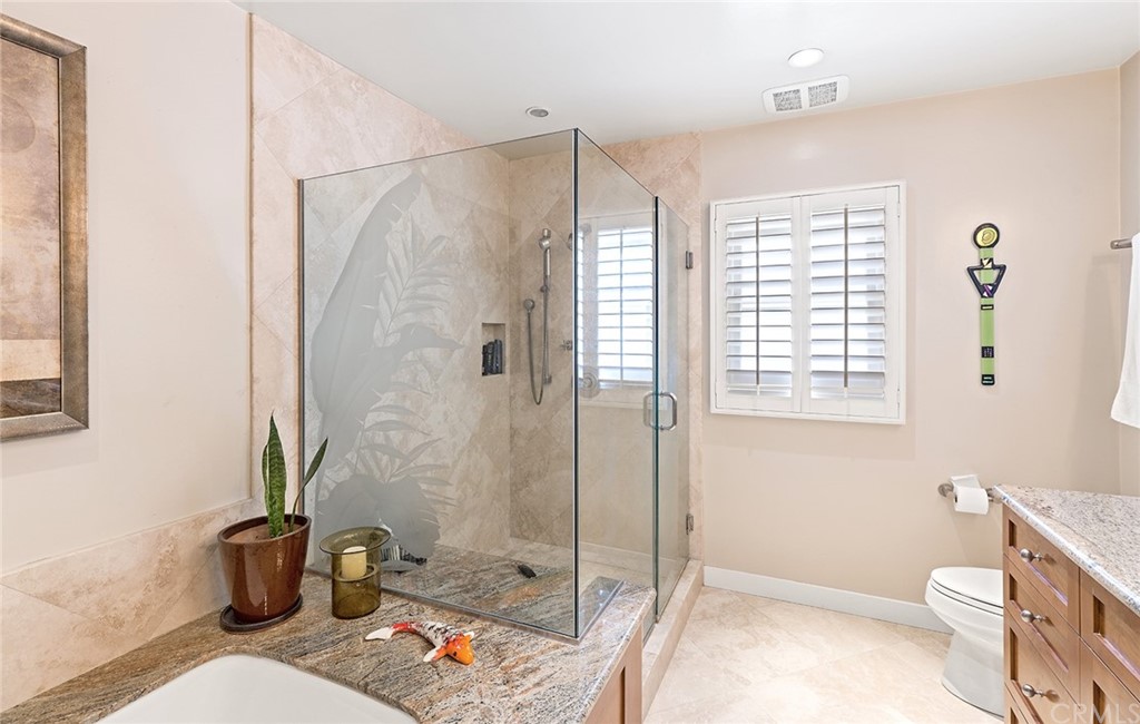 7 Beacon Bay Newport Beach, CA 92660 - Photo 33 of 59 a bathroom with a sink toilet and shower
