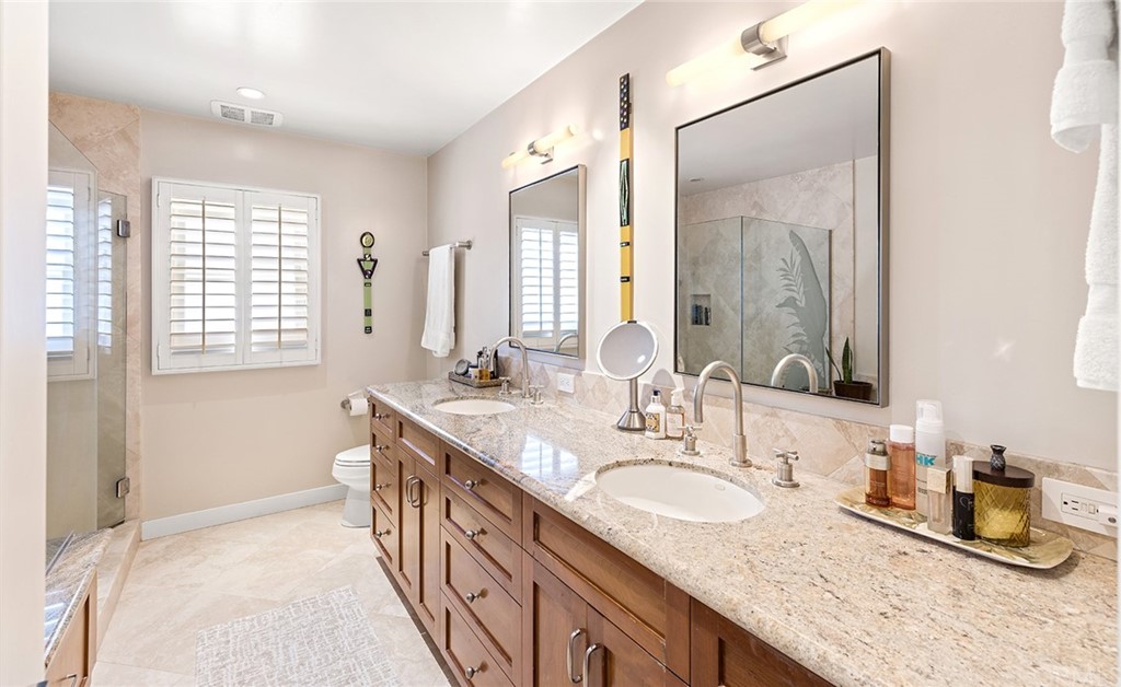 7 Beacon Bay Newport Beach, CA 92660 - Photo 34 of 59 a bathroom with granite countertop double vanity and a mirror