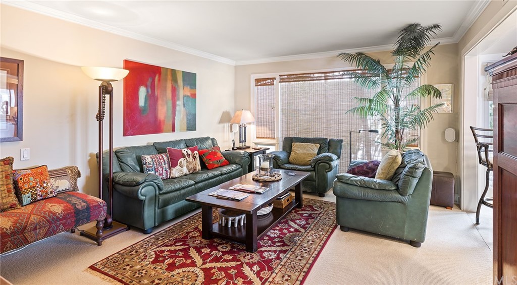 7 Beacon Bay Newport Beach, CA 92660 - Photo 35 of 59 a living room with furniture a fireplace and a table