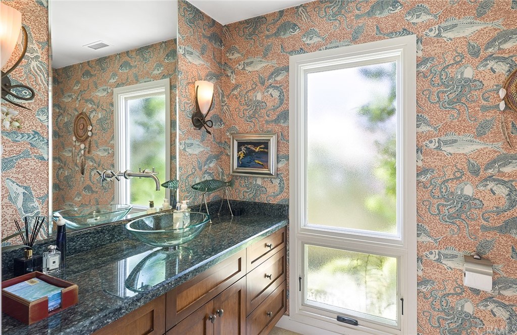 7 Beacon Bay Newport Beach, CA 92660 - Photo 37 of 59 a bathroom with a granite countertop sink and a mirror