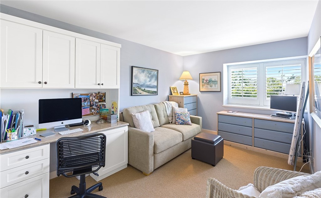 7 Beacon Bay Newport Beach, CA 92660 - Photo 38 of 59 a living room with furniture and a flat screen tv