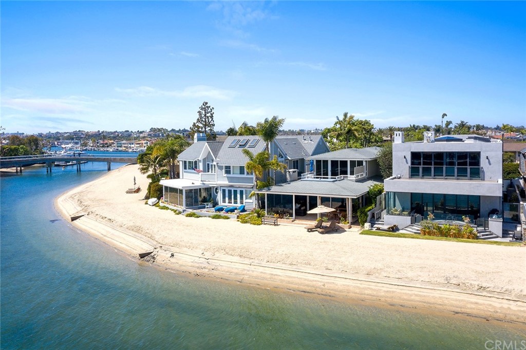 7 Beacon Bay Newport Beach, CA 92660 - Photo 42 of 59 a view of a white house with a ocean view
