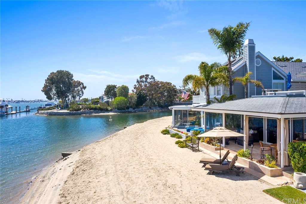 7 Beacon Bay Newport Beach, CA 92660 - Photo 50 of 59 a view of a lake with a house