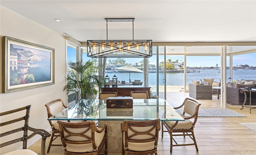 7 Beacon Bay Newport Beach, CA 92660 - Photo 8 of 59 a dining room with furniture a chandelier and wooden floor