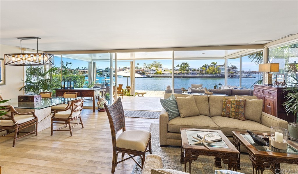 7 Beacon Bay Newport Beach, CA 92660 - Photo 9 of 59 a living room with furniture and a floor to ceiling window