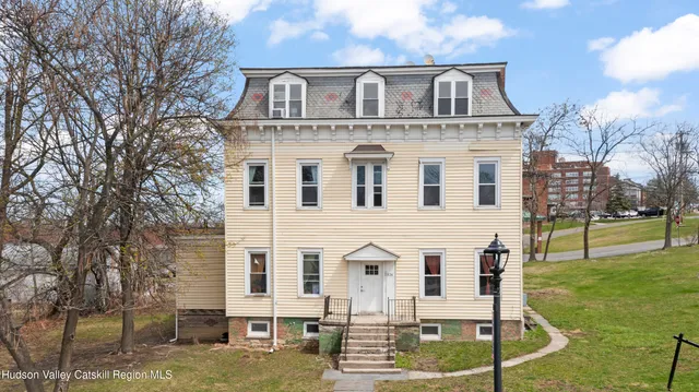 a front view of a house with garden