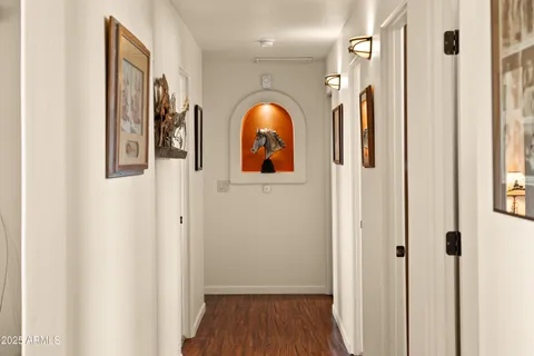 a view of a livingroom with wooden floor and windows
