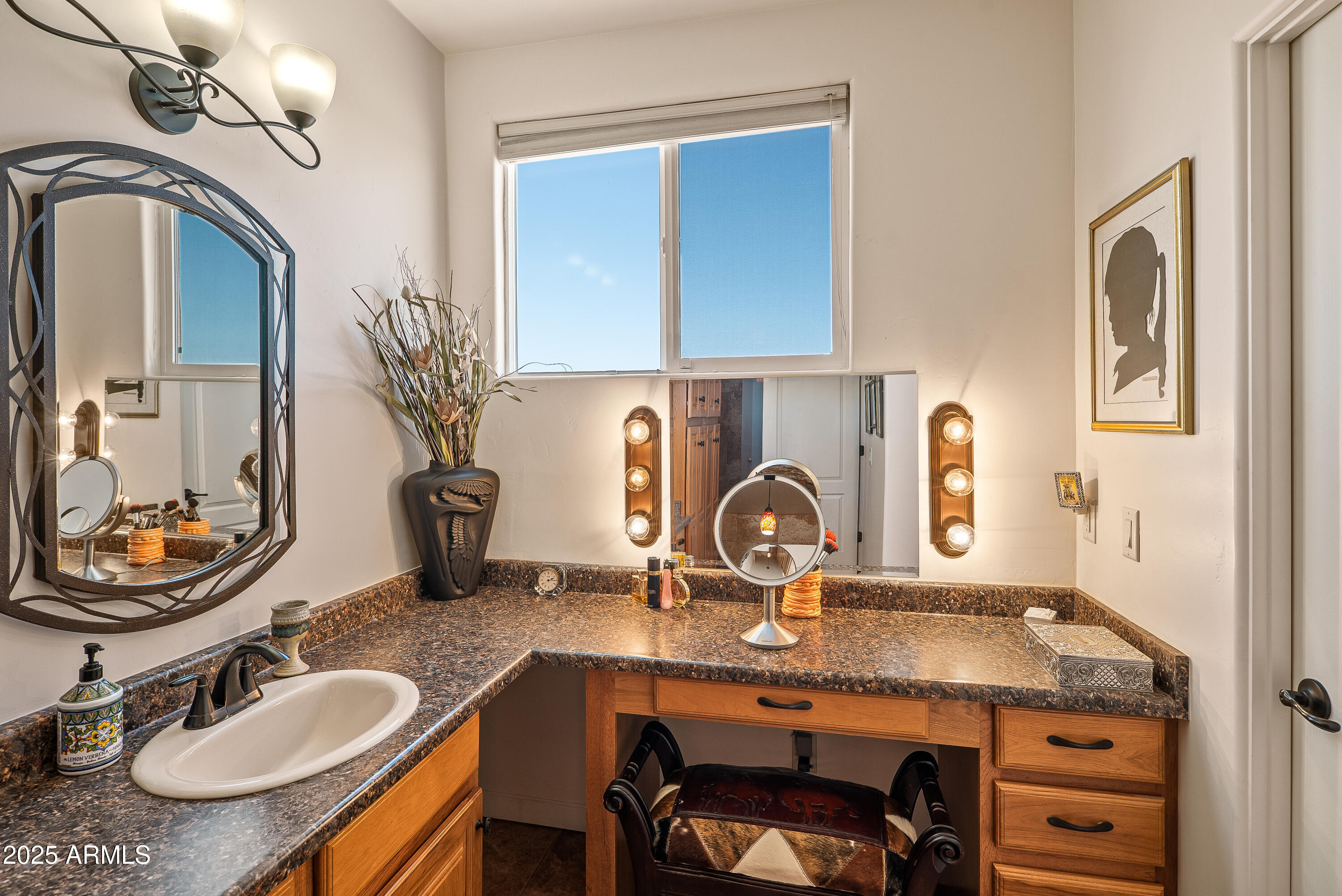 7375 East Sliding Stop Lane Cornville, AZ 86325 - Photo 16 of 53 a bathroom with a granite countertop sink a mirror and vanity