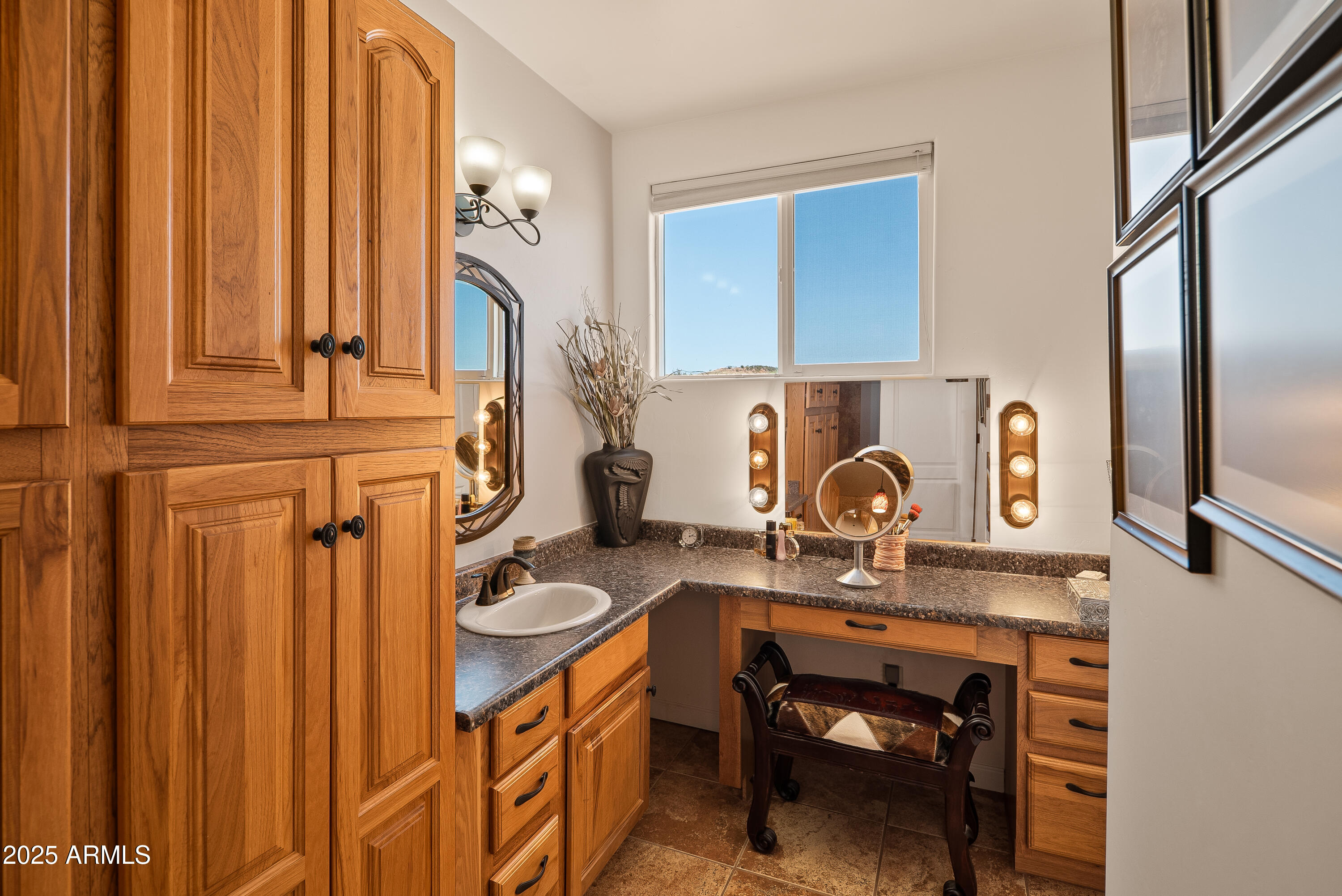 7375 East Sliding Stop Lane Cornville, AZ 86325 - Photo 17 of 53 a bathroom with a sink a vanity and mirror
