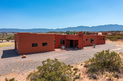 a view of a swimming pool with an outdoor seating