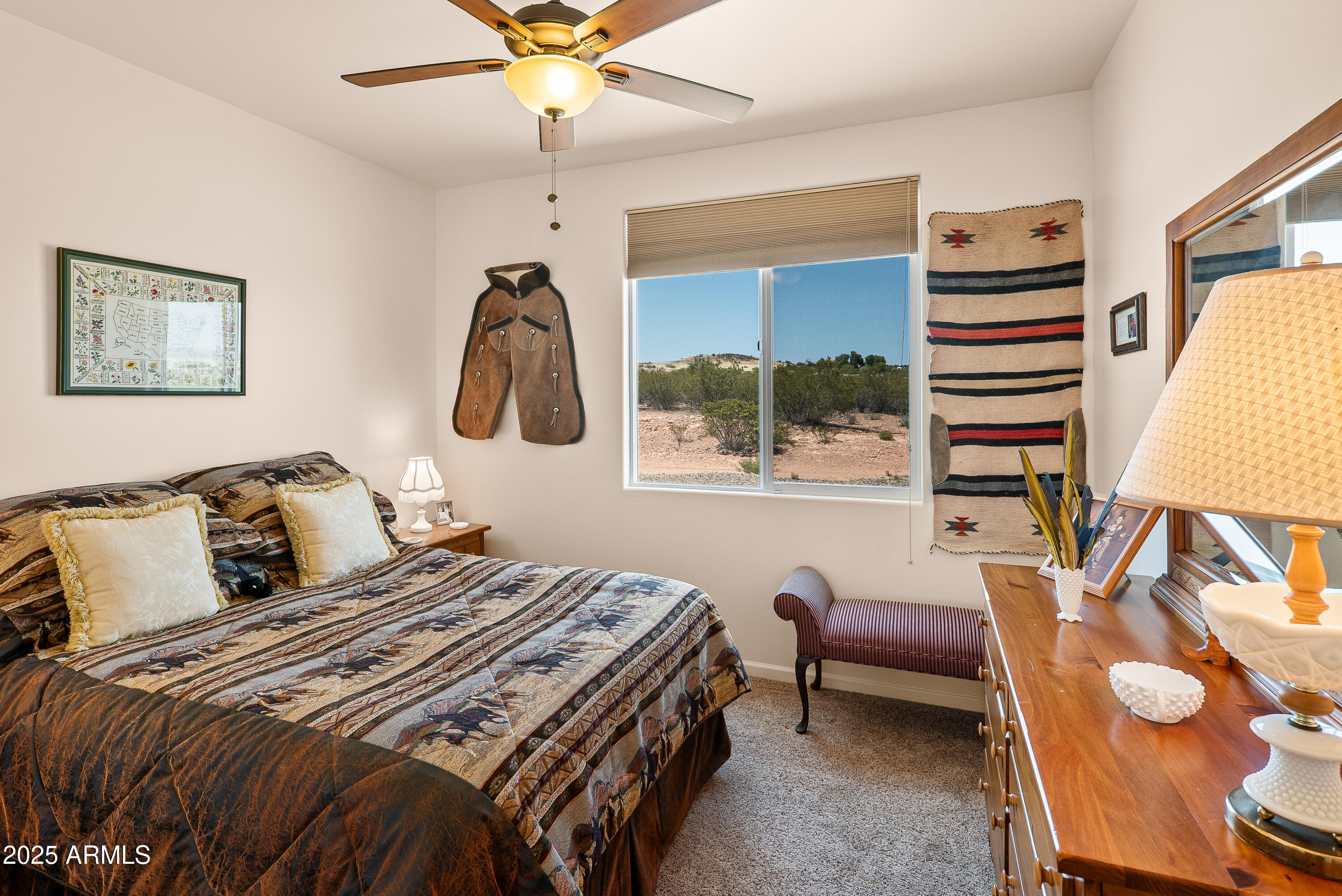 7375 East Sliding Stop Lane Cornville, AZ 86325 - Photo 21 of 53 a bedroom with a bed and wooden floor