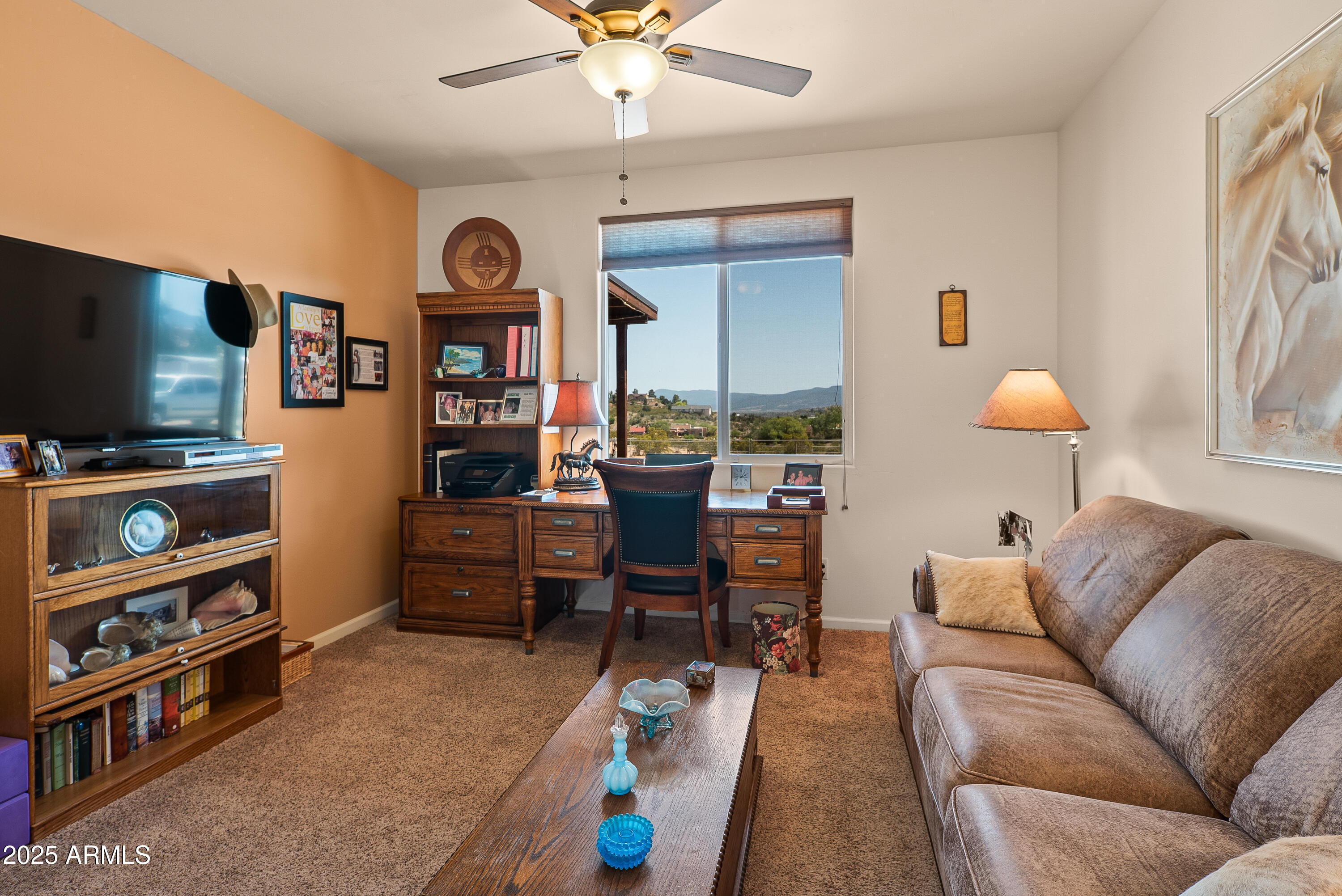 7375 East Sliding Stop Lane Cornville, AZ 86325 - Photo 23 of 53 a living room with furniture and a flat screen tv