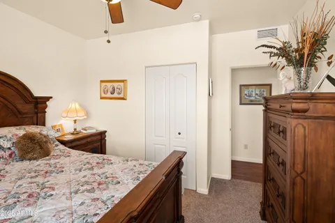 a bedroom with a bed and a dresser