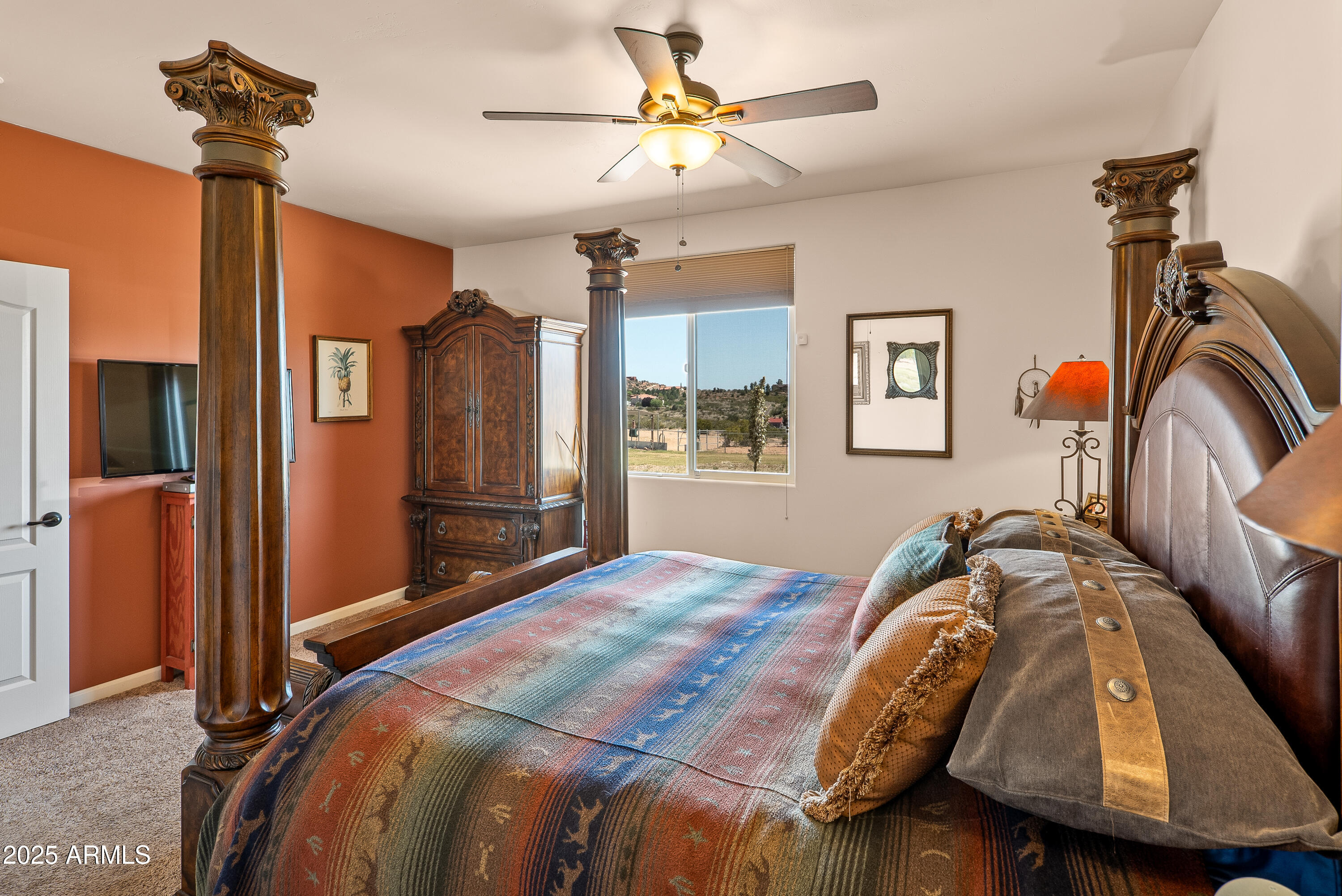 7375 East Sliding Stop Lane Cornville, AZ 86325 - Photo 50 of 53 a bedroom with a bed and a chandelier