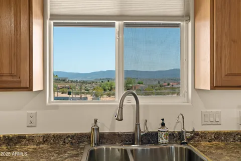 a kitchen with a sink and a window