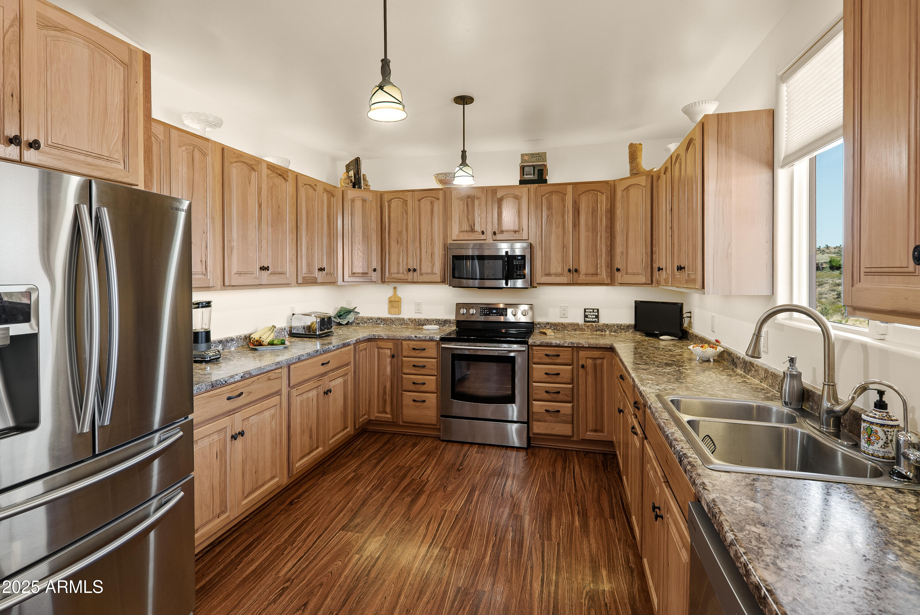 7375 East Sliding Stop Lane Cornville, AZ 86325 - Photo 6 of 53 a kitchen with kitchen island granite countertop a sink appliances cabinets and counter space