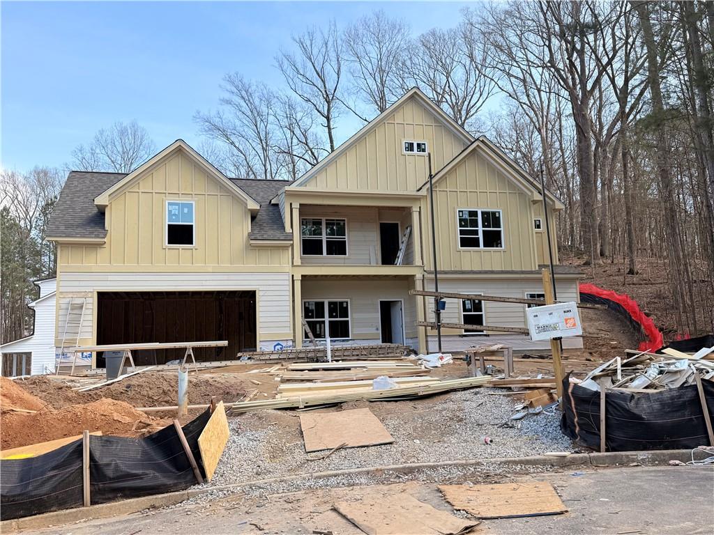 a view of house with yard outdoor seating and barbeque oven