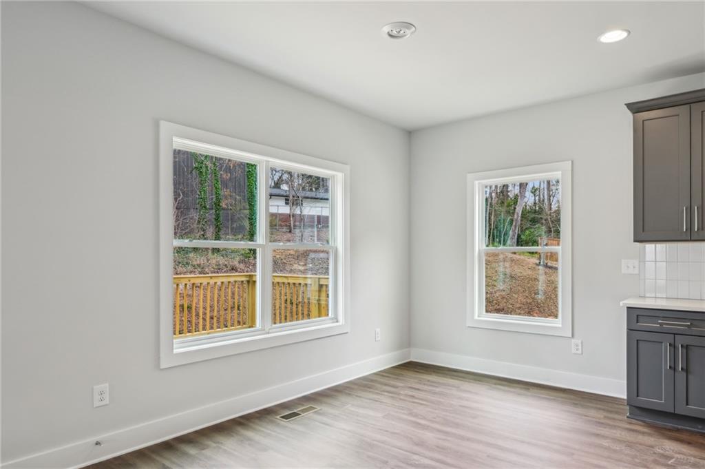 3128 Stonegate Drive Atlanta, GA 30331 - Photo 11 of 35 a view of an empty room with a window and wooden floor