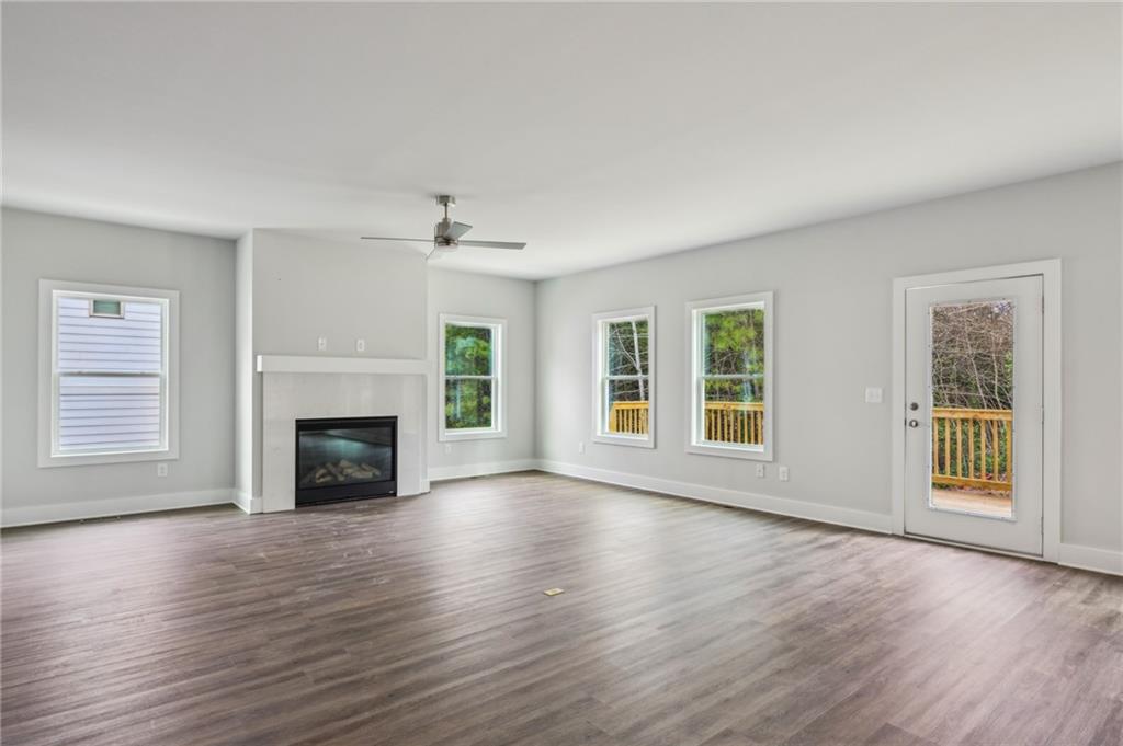 3128 Stonegate Drive Atlanta, GA 30331 - Photo 15 of 35 a view of an empty room with wooden floor and a window