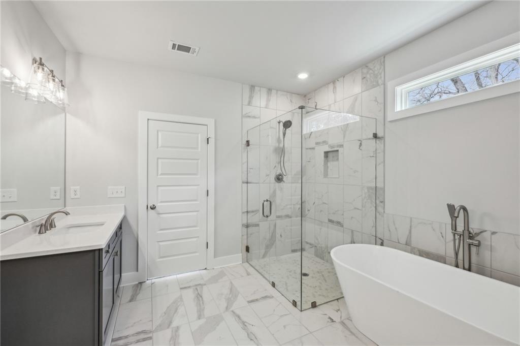 3128 Stonegate Drive Atlanta, GA 30331 - Photo 23 of 35 a bathroom with a bathtub shower sink mirror and toilet