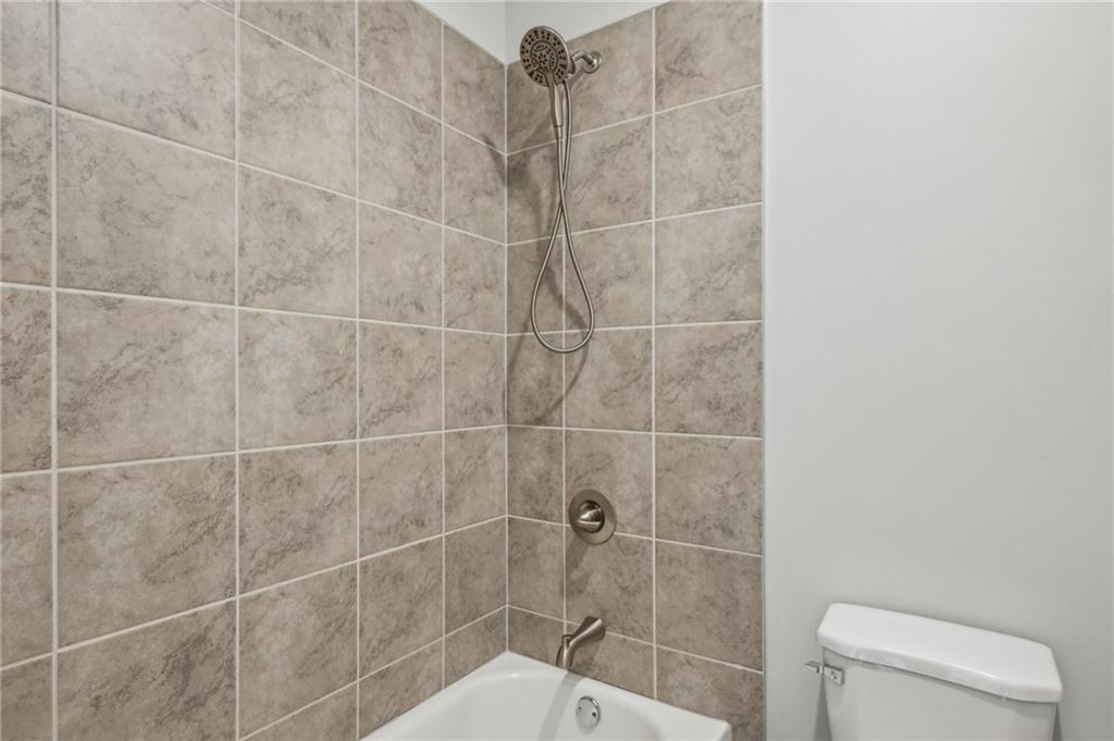 3128 Stonegate Drive Atlanta, GA 30331 - Photo 29 of 35 a bathroom with a toilet and a shower