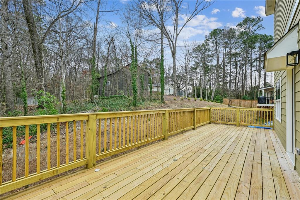 3128 Stonegate Drive Atlanta, GA 30331 - Photo 30 of 35 a view of a balcony with wooden floor and outdoor space