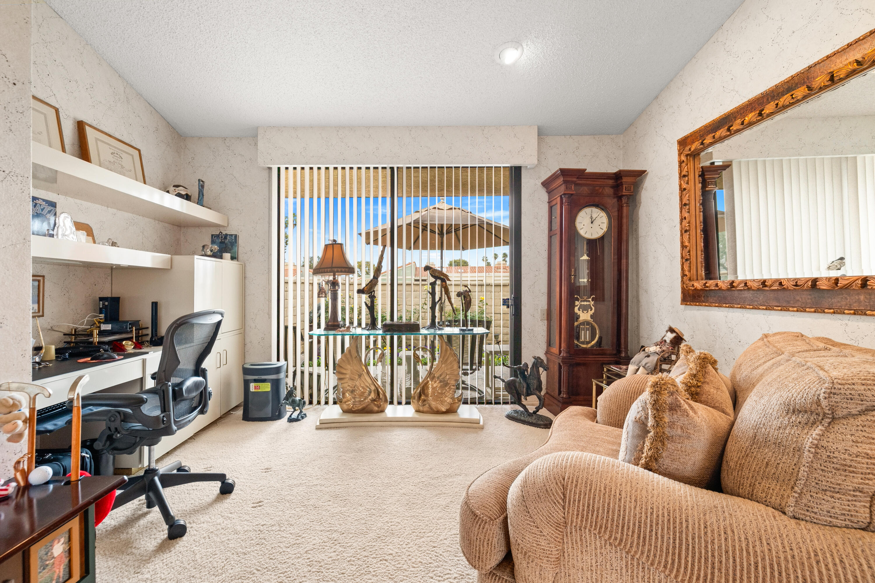 72419 Rodeo Way Rancho Mirage, CA 92270 - Photo 12 of 48 a living room with furniture a flat screen tv and a large window