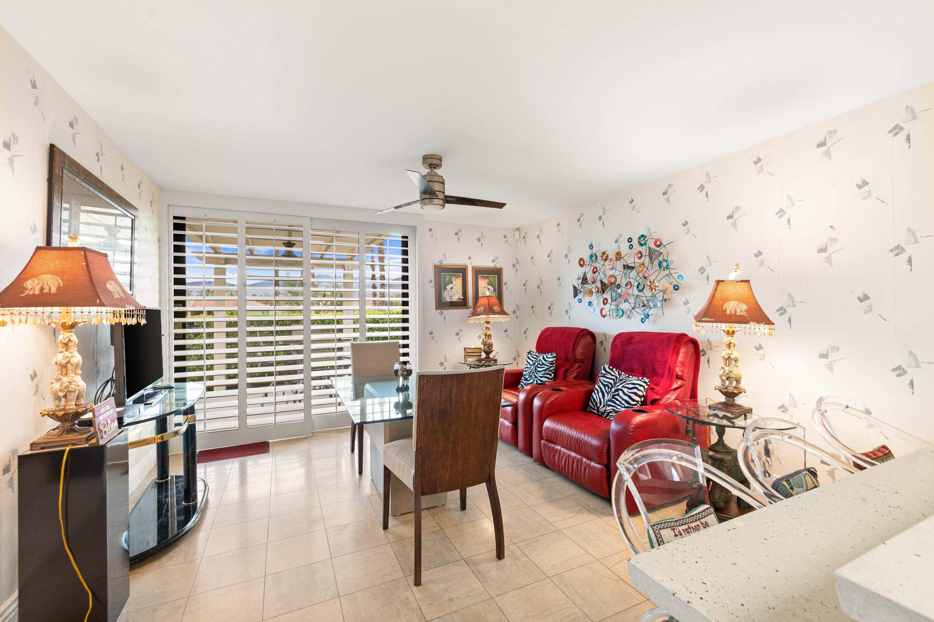 72419 Rodeo Way Rancho Mirage, CA 92270 - Photo 20 of 48 a living room with furniture a flat screen tv and a window