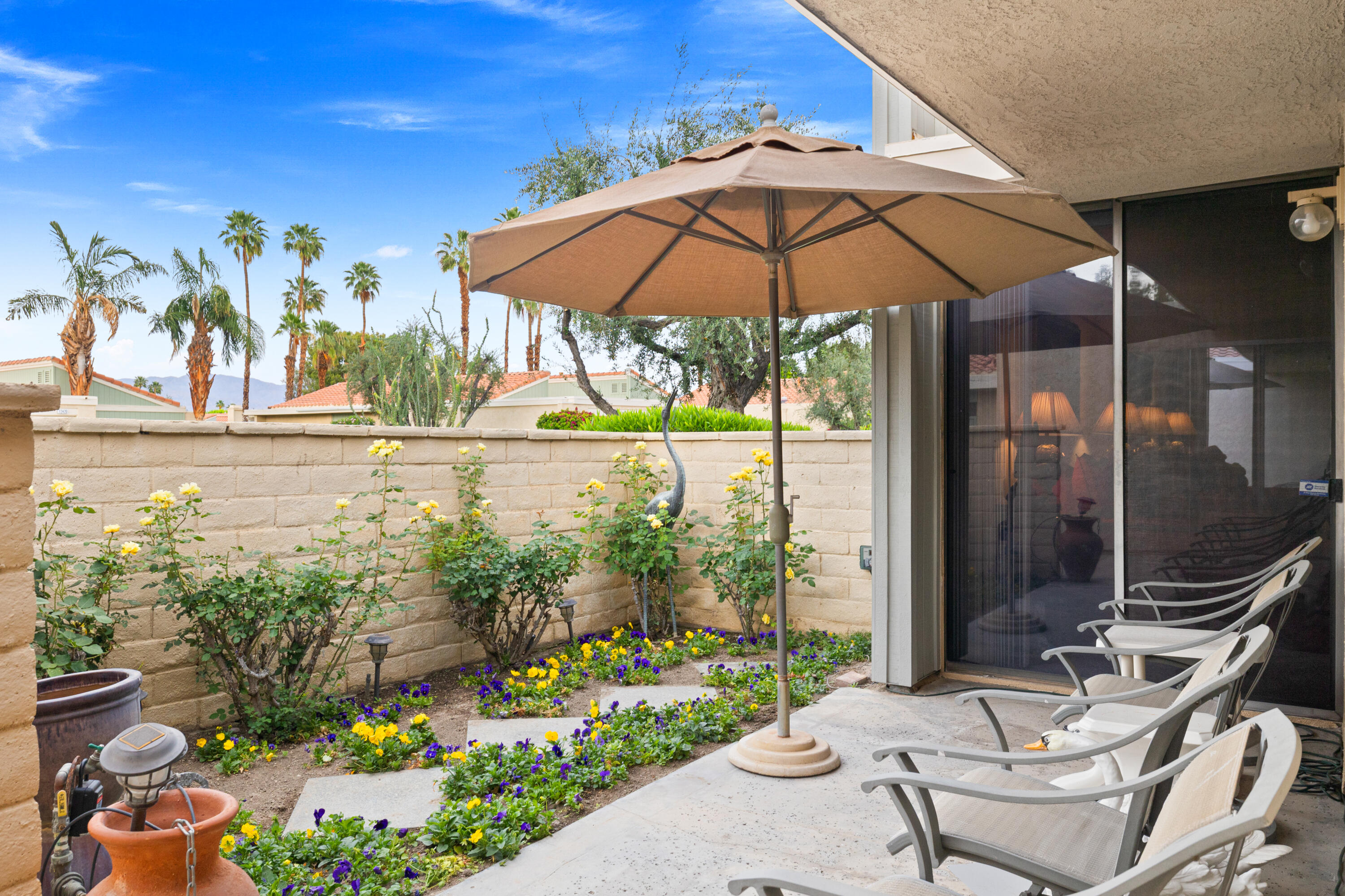 72419 Rodeo Way Rancho Mirage, CA 92270 - Photo 3 of 48 a garden view with a seating space
