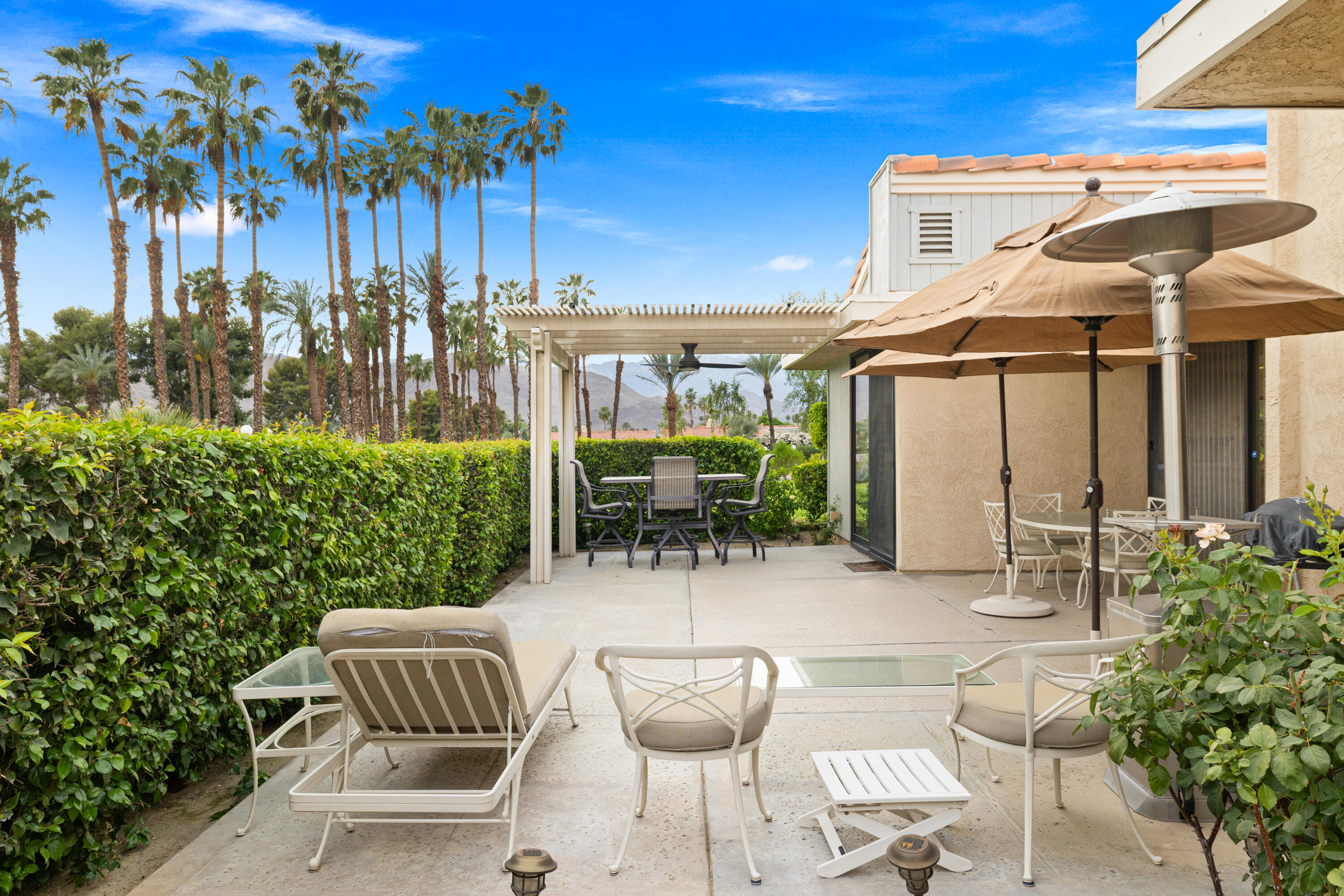 72419 Rodeo Way Rancho Mirage, CA 92270 - Photo 33 of 48 a patio with glass top table and chairs