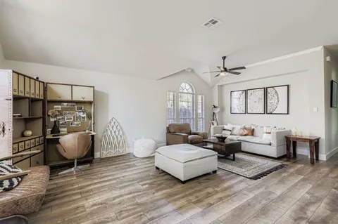 a living room with furniture and a window