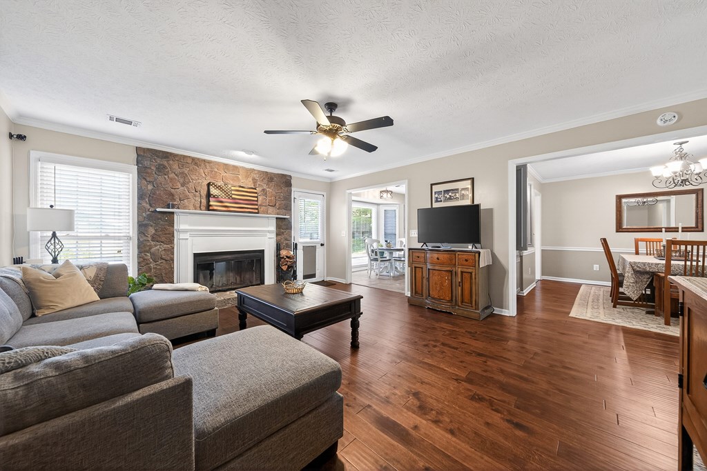 7333 Cedar Creek Loop Columbus, GA 31904 - Photo 6 of 37 a living room with fireplace furniture and a flat screen tv