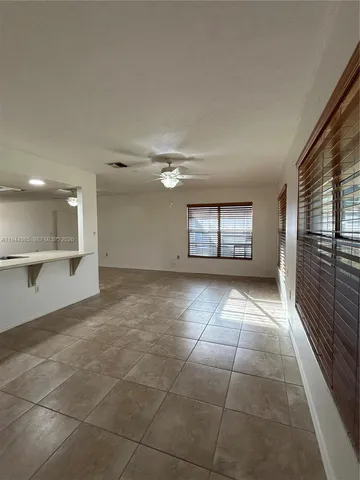 a view of an empty room and a window