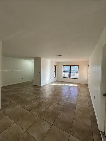 a view of an empty room and window