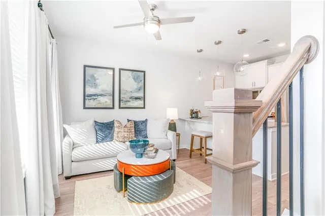 a living room with furniture and a painting