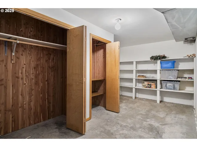 a view of an empty room with a cabinet