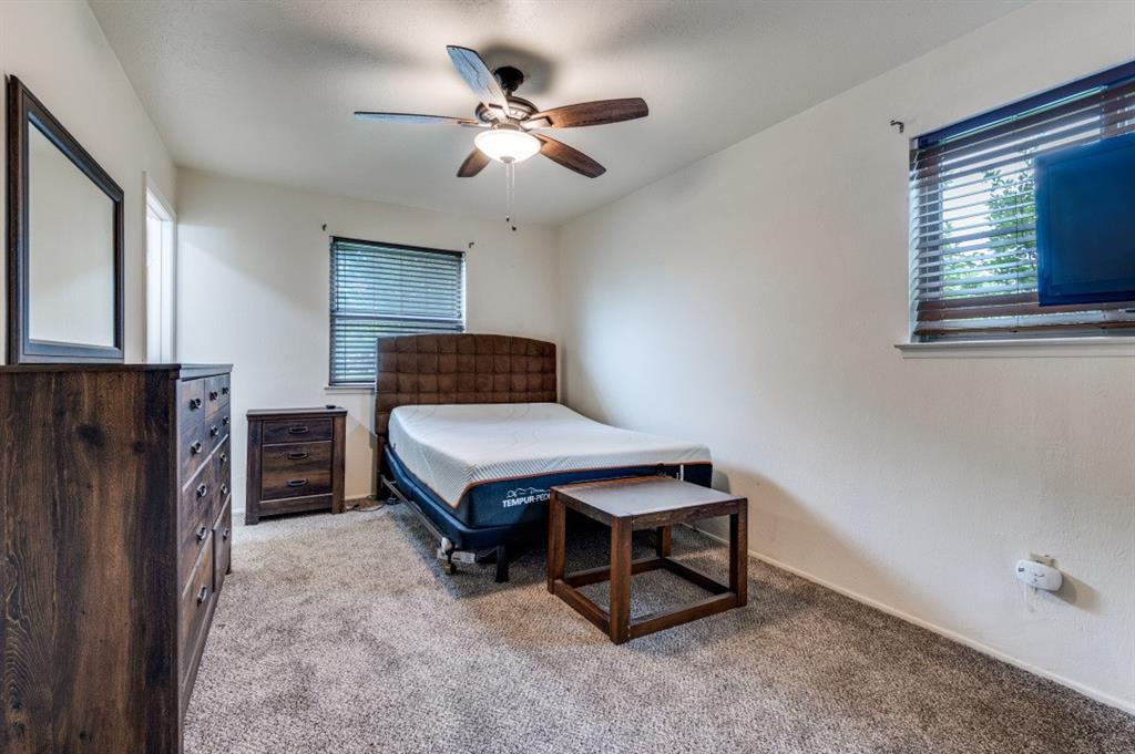 2413 Cheyenne Street Irving, TX 75062 - Photo 12 of 19 a bedroom with a bed and window