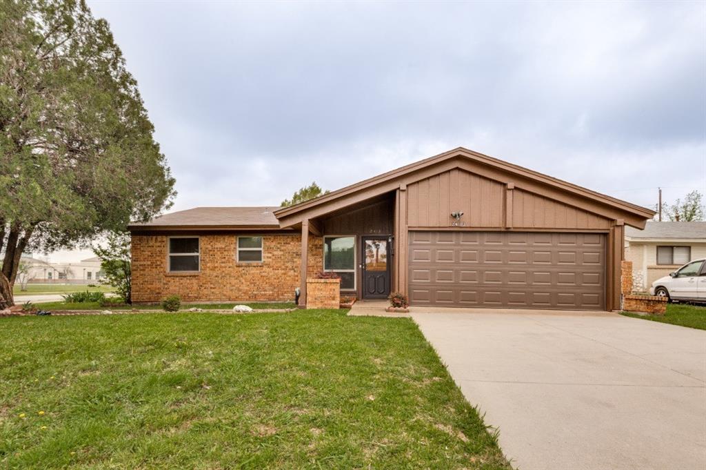 2413 Cheyenne Street Irving, TX 75062 - Photo 2 of 19 a front view of house with yard and green space